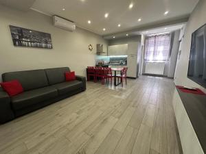 a living room with a couch and a table at Mazzini Home in Cosenza