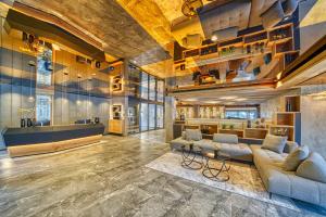 a living room with a couch and a table at Hotel Avelina in Avelengo