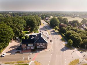 an aerial view of a building and a street at Ferienwohnung im Hotel Preyt 35228 in Holtlander Nücke