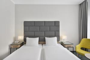 Danubius Hotel Raba客房内的一张或多张床位