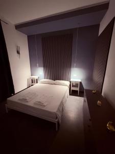 Letto o letti in una camera di La cittadella rooms 2