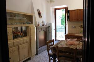 a kitchen with a table and a dining room at Belvedere Gino e Maria in Caprarola