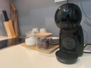 a black blender sitting on a kitchen counter at Apartment in Bansko, very close to the Gondola in Bansko