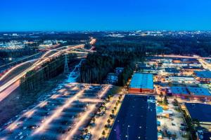 an aerial view of a city at night at Scandic Victoria Tower in Stockholm
