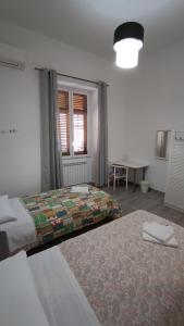 Postel nebo postele na pokoji v ubytování Tati's Garden