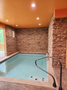a large swimming pool with a brick wall at Three bears lodge in Gatlinburg