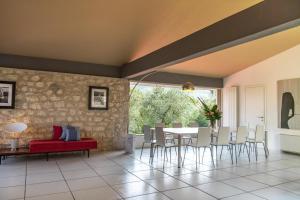 a dining room with a table and chairs at Villa Elena in Manerba del Garda