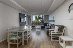 a living room with a couch and a table at The Breakers 310 in Durban