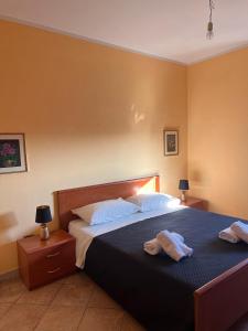 Ένα ή περισσότερα κρεβάτια σε δωμάτιο στο Casa Cappuccini