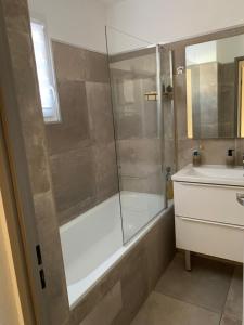 a bathroom with a shower and a sink at La Petite Villa du Soleil in Lavalette +16 photos