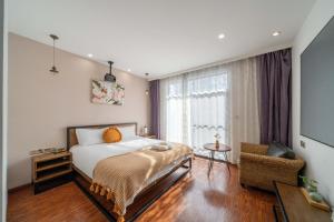 Postel nebo postele na pokoji v ubytování Shanghai nanfeng hotel-上海楠枫花园酒店