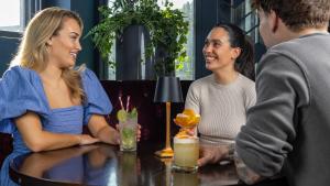 a group of people sitting at a table in a restaurant at Midlands Park Hotel in Portlaoise