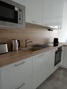 Kuchyň nebo kuchyňský kout v ubytování Villapark Apartmanok A-B 3, 4,