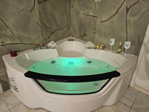 a jacuzzi tub in a bathroom with at Florence Colonna Spa in Florence