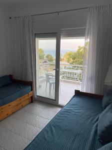 Ένα ή περισσότερα κρεβάτια σε δωμάτιο στο selana sea sunrise view