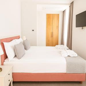 Postel nebo postele na pokoji v ubytování Hotel Casa di Sofia