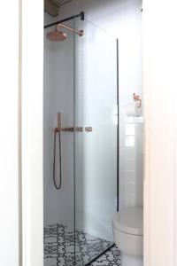a bathroom with a glass shower with a toilet at Casa Degrassi - Main square - Seaview in Vrsar
