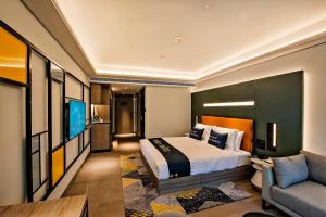 Tempat tidur dalam kamar di Mustel