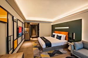 Tempat tidur dalam kamar di Mustel