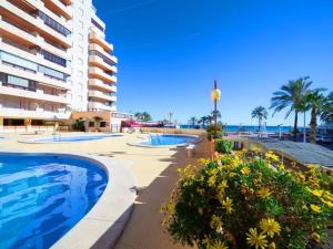 a resort with a swimming pool and a building at Zafiro Calpe by Concept Flats in Ifach