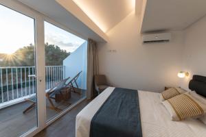 Ένα ή περισσότερα κρεβάτια σε δωμάτιο στο Brum Design Apartments II +38 φωτογραφίες