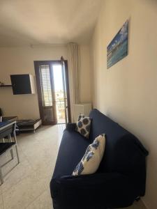 TV a/nebo společenská místnost v ubytování Casa Vacanze Tridente