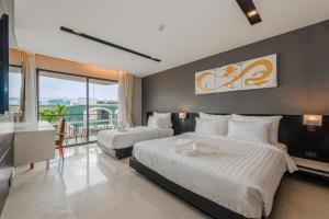 Letto o letti in una camera di C197 Condo 1BR with Pool 3 Min Walk to Beach
