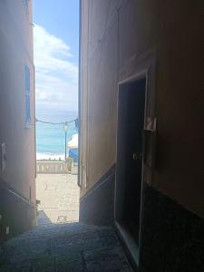 an open door of a building with a view of the ocean at Blue Windows in Camogli