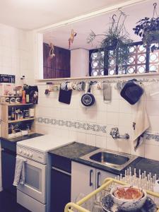 a kitchen with a sink and a counter top at Cosy apartment with fabulous SEA VIEWS 70's style in Sant Feliu de Guixols