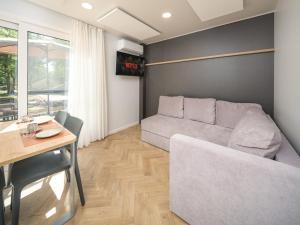 Et opholdsområde på Moezel Lodge met hottub | 4 Personen