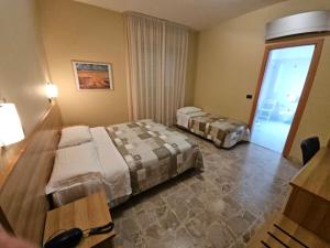 Voodi või voodid majutusasutuse Hotel Mazzocchetti toas