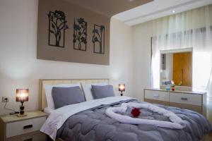 a bedroom with a large bed with a red flower on it at R101-6- Lovely and Spatious apartments in Belvedere near High Speed Train Station in Casablanca