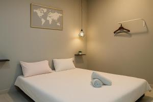 Postel nebo postele na pokoji v ubytování ENDLESS SUMMER Jesselton Quay Kota Kinabalu 來繕旅遊