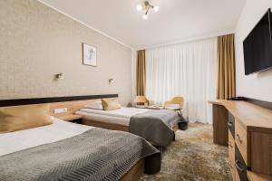 Postel nebo postele na pokoji v ubytování Complex Balnear Cozia - Corp Caciulata