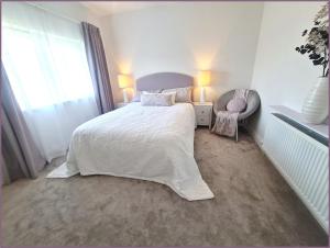 Rúm í herbergi á Quiet & Relaxing Home in Frankfield