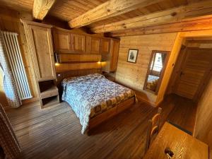 Postel nebo postele na pokoji v ubytování HIBOU Chambres - Cogne