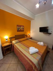 a hotel room with a bed with towels on it at Residenza Eolo in Tropea