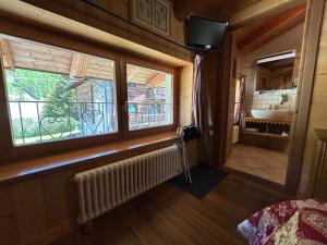 Postel nebo postele na pokoji v ubytování HIBOU Chambres - Cogne