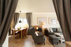 a living room with a couch and a table at Ferienhaus Brasch in Grömitz
