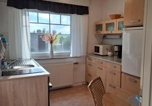 a kitchen with a sink and a window at 30 qm Fewo ländliche Lage Nossen in Nossen +1 photo