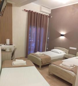 Кровать или кровати в номере Hotel Isidora