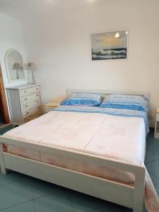 Postel nebo postele na pokoji v ubytování Stella di Mare