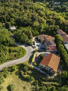 an aerial view of a house with a winding road at Elba Mare & Relax in Marciana