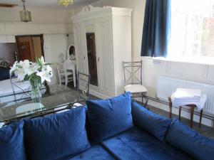a living room with a couch and a glass table at Riverside Lodge At Bridge Stores in Great Yarmouth