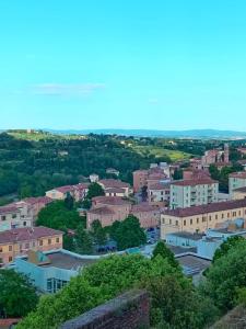 a view of a city with buildings and trees at Interno 7 in Siena