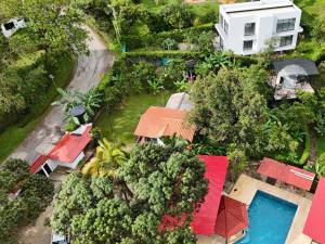 an overhead view of a house with a pool and trees at Eco Boutique-Sierra in La Vega