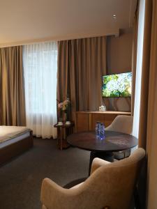 Primavera Hotel的电视和/或娱乐中心