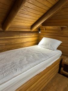 a bed in a wooden room in a sauna at Luxury Glamping Grabovica - Vital Resort in Skender Vakuf