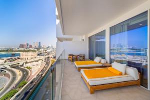 a bedroom with two beds and a view of a city at EDEN'S Homes & Villas - FIVE Palm Residences in Dubai +178 photos
