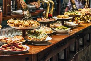 a buffet with many plates of food on a table at Etxeberria in Zarautz